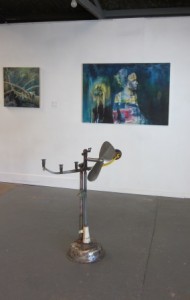 At the Studeo Gallery- A Chris Meek creation in the foreground with Brigid Allan paintings on the wall behind