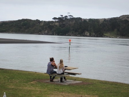Enjoying life and the Raglan Harbour view at one of the new tables