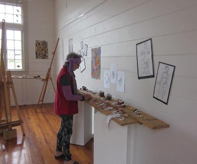 131026MatchBoxAnnetteIMG_2265 Annette May makes finishing touches to a small part of the Matchbox exhibition.