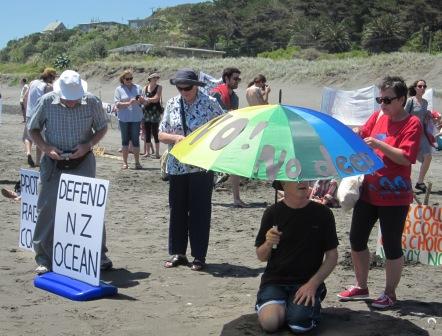 131123UmbrellaIMG_2371 No Deep Sea Oil protest umbrella on the beach at Raglan
