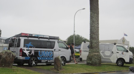 Vans parked on median strip in Bow Street, Raglan