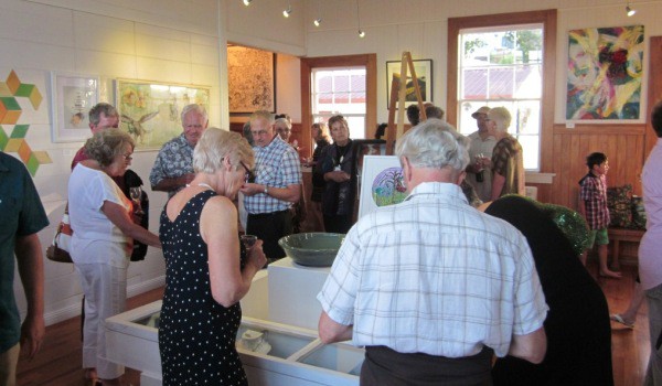 Art lovers and artists at the preview evening for the Raglan Art Weekend.