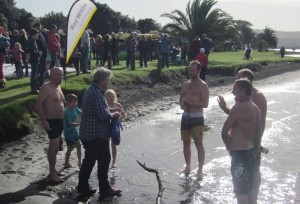 Dave Hanna presents prizes for the mid-winter swim winners