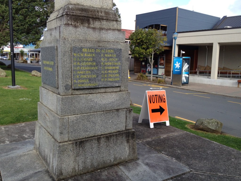 Voting direction sign next to the Raglan War Memorial. A symbolic reminder of those who gave their lives so we could vote. Image- Robyn Gallagher