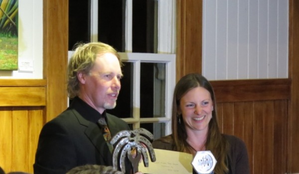 Anna from Solar Cycle presents the inaugural Phoenix Palm award to Aaaron Moar