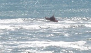 Raglan Coastguard's Gallagher Rescue crosses the Raglan bar – Image NZ Navy