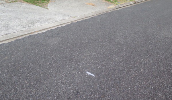 Road condition marker line on Cambrae Rd, Raglan painted by an NZTA contractor