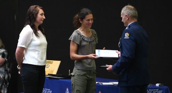 Monique Alexander (left) and Sarah Jones (centre) receive their District Commander Commendation awards.