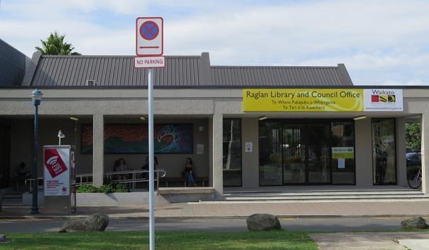 NOW YOU DON'T: In 2016 there are no flagpoles on the Raglan council building. But there is a lovely no parking sign that has just been installed on the centre grass island.