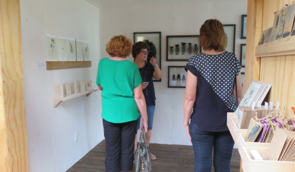 Visitors discuss art with artists at the Studeo Gallery