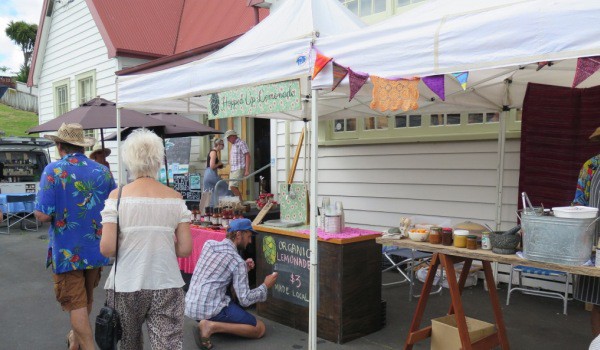 Lenny adds final touches to his Hopped Up Lemonade stall at the Little Food Fest at Raglan Old School Arts Centre