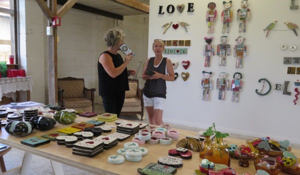 Hayley Hamilton talks to a visitor at the Monster Company Gallery in Wallis Street