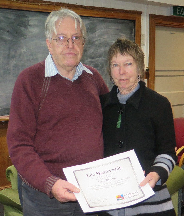 Rodger Gallagher presents the life membership certificate to Jenny Rhodes