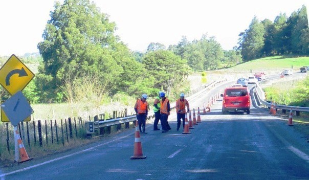 NZTA contractors make final checks on rebuilt safety barrier before fully opening SH 23.