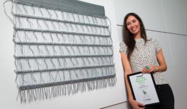 Consecutive Fieldays No. 8 Wire National Art Award finalist Cherise Thomson with her work Korowai, which placed second in 2016.