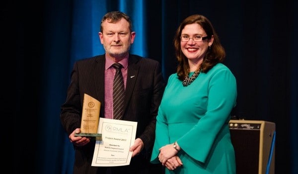 Fresh water strategy’s lead author, principal strategic advisor Blair Dickie, with the award at the weekend conference in Auckland. With him is Rachel Devine, a partner at MinterEllisonRuddWatts and a member of the association’s awards sub-committee.