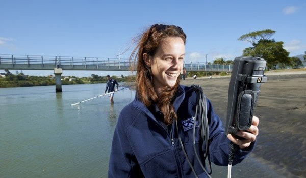WRC staff member Hannah Jones carrying out coastal water quality sampling at Raglan - Image supplied