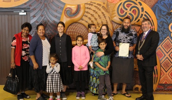 John George with his family at the citizenship ceremony. Image WDC