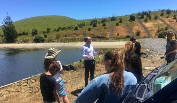 Waikato District Council Waters Treatment and Service Team Leader Mark Curtis shows Raglan Area School students around the town’s sewage treatment ponds. Image WDC