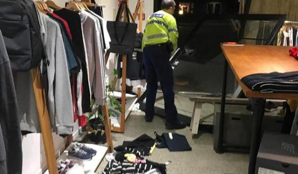 Police inspect the Fallenfront shop. Image FB