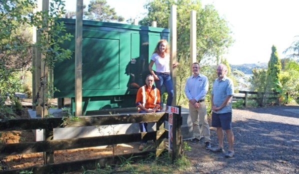 From left, Reticulation Serviceman Roger Smith, Raglan Ward Councillor Lisa Thomson, Waters Operations Team Leader Robert Ball and local resident Dermot Murtagh in front of the new Greenslade Road generator. Image supplied