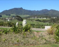 The four winds pieces that form the Whaingaroa Creative Sculptures at Wainui Reserve. The sculptures were created in 2001 and sited at Wainui Reserve in 2002. Bible Camp and Mount Karioi in background. 150304wainuireservefourwindssculptures